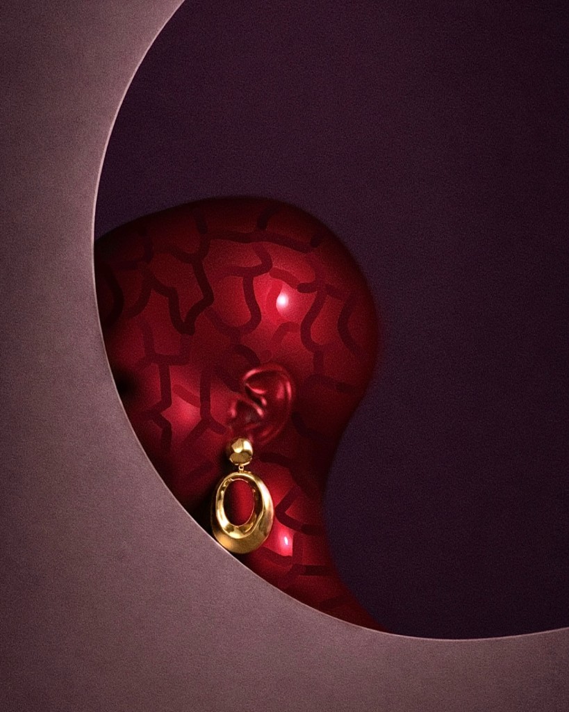 Red figure with gold earring framed inside an arched aperture